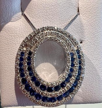 14k white gold sapphire and diamond pendant. D:0.49 C:0.60